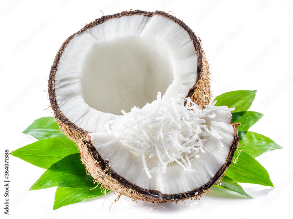 Cracked coconut fruit with white flesh and shredded coconut flakes isolated on white background. Cracked coconut fruit with white flesh and shredded coconut flakes isolated on white background.