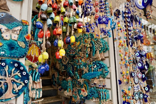 Bodrum, Turkey - August, 2020: souvenirs with evil eyes, masks, lanterns at the local market. Turkish souvenirs of Grand Bazaar. With selective focus