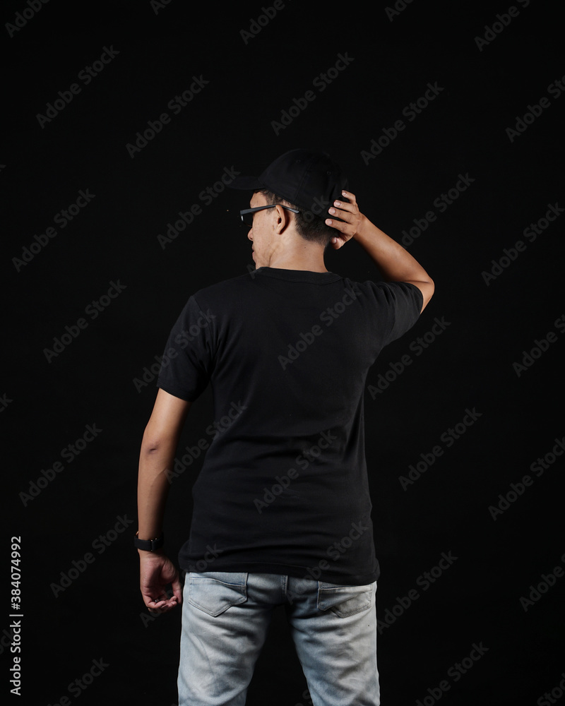 Young men in empty black T-shirts, stylish and posing like famous T-shirt models. Men's t-shirt template and mockup design for print. photo shoot models isolated black background.