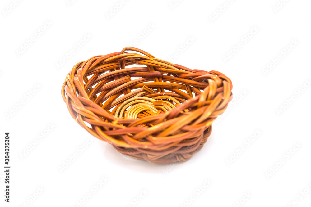 Small wicker basket on a white background. High quality photo
