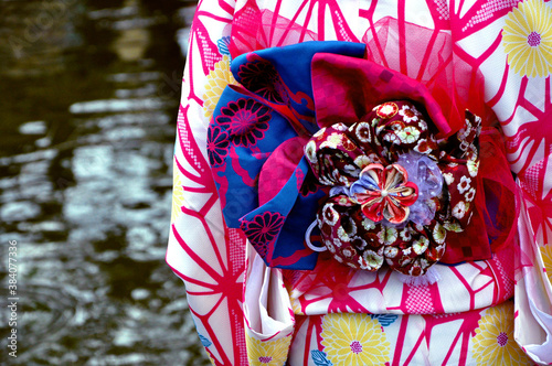 Beautiful pink Kimono Obi with textile flowers, called sash (Japanese traditional wear belt) photo