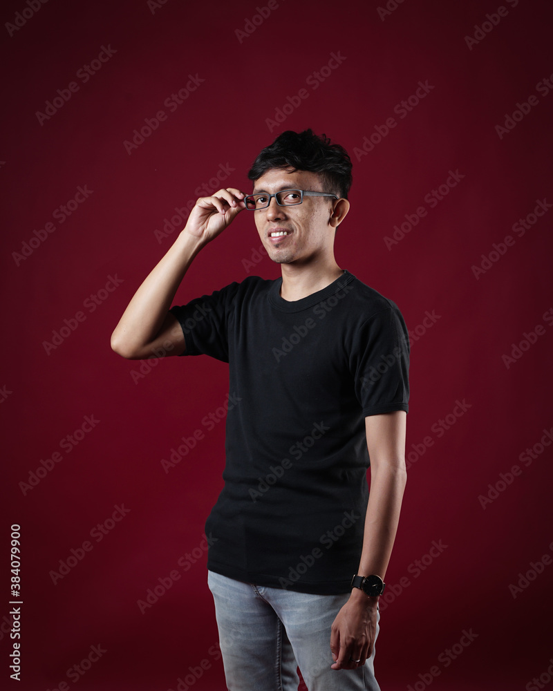 Young men in empty black T-shirts, stylish and posing like famous T-shirt models. Men's t-shirt template and mockup design for print. Young men in empty black T-shirts, stylish and posing like famous T-shirt models. Men's t-shirt template and mockup design for print.