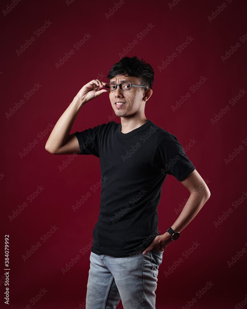 Naklejka premium Young men in empty black T-shirts, stylish and posing like famous T-shirt models. Men's t-shirt template and mockup design for print.