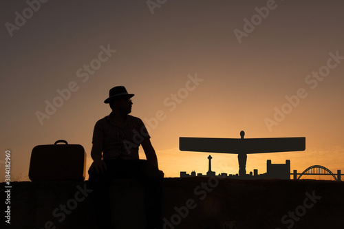 man next to silhouette skyline of Gateshead city photo