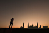 man in front of zaragoza city skyline in spain