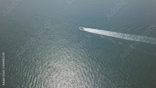 Wallpaper Mural Drone footage of a watercraft underway traveling across the vast ocean.  Torontodigital.ca
