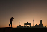 man in front of berlin city skyline in germany