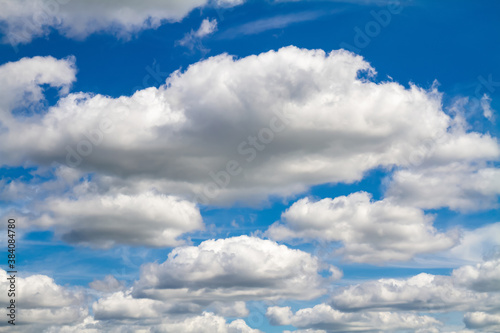 Blue sky background with white clouds © marketlan