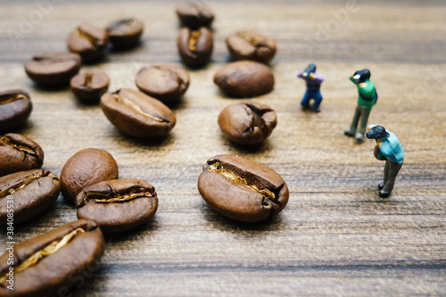 miniature photographer take a picture of coffee beans  photo