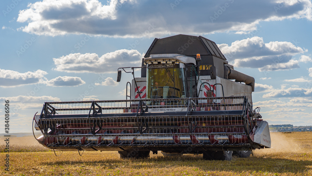 combine harvester working on a field combine harvester working on a field
