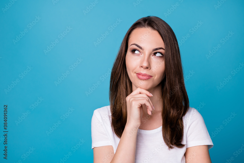 Closeup photo of attractive charming lady hold arm on chin look flirty up empty space thinking sly eyes creative intelligent person wear casual white t-shirt isolated blue color background Closeup photo of attractive charming lady hold arm on chin look flirty up empty space thinking sly eyes creative intelligent person wear casual white t-shirt isolated blue color background