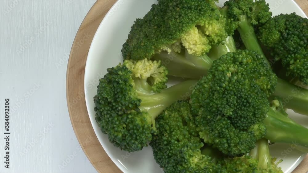 Green slices of broccoli cabbage on a plate close-up Green slices of broccoli cabbage on a plate close-up