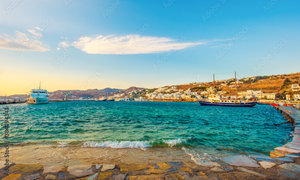 View of the Mykonos island from seafront at sunset