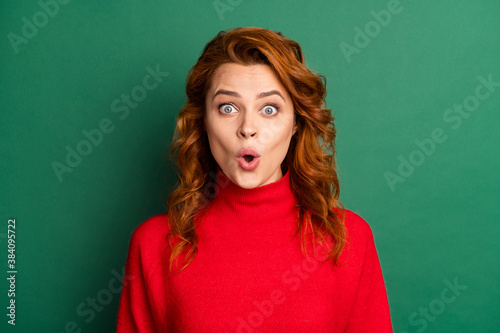 Photo of cute young lady surprised expression open mouth wear red sweater isolated green color background