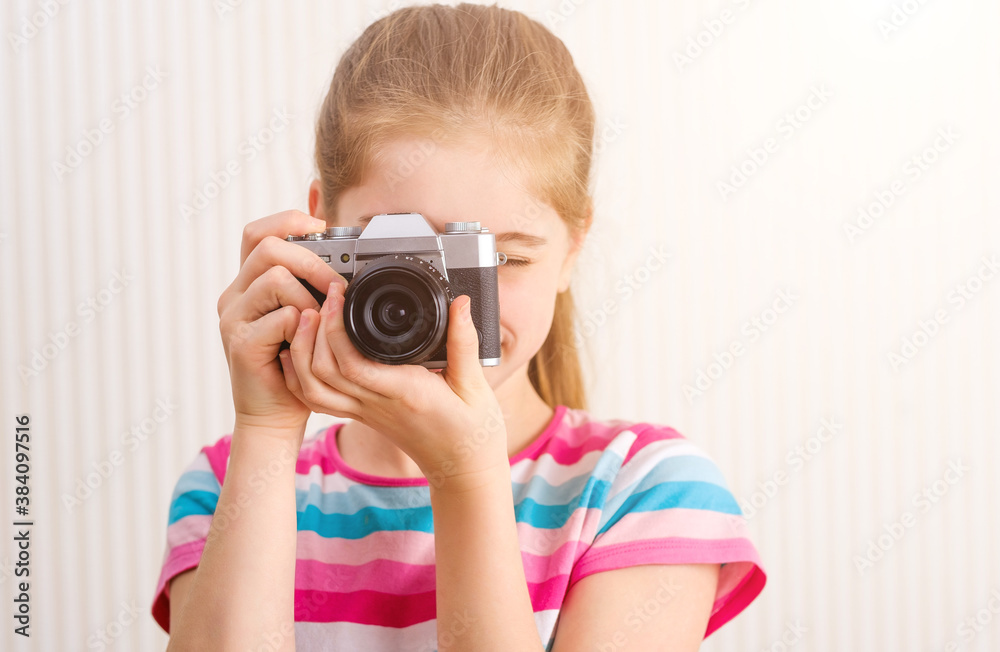 Attractive girl taking photo looking directly at spectator Attractive girl taking photo looking directly at spectator