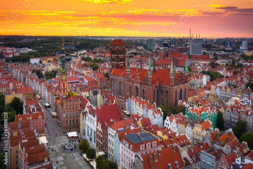 Beautiful sunset over the old town of Gdansk with City Hall and St. Mary Basilica, Poland