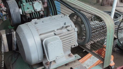 Air Compressor Motor Running in Car or Auto Repair Shop in Zoom View