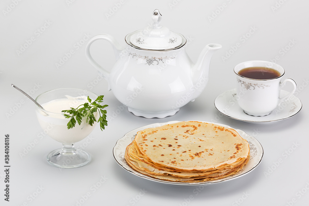 wonderful delicious tea with hot pancakes and fresh sour cream wonderful delicious tea with hot pancakes and fresh sour cream