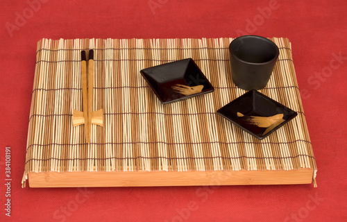 Still life from tray with chinese stick's and sauce-boat