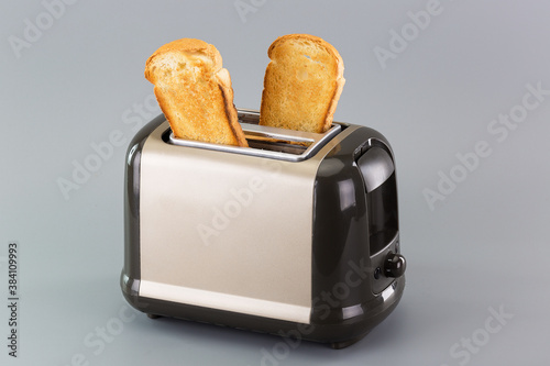 process of making delicious bread toasts in an electric toaster