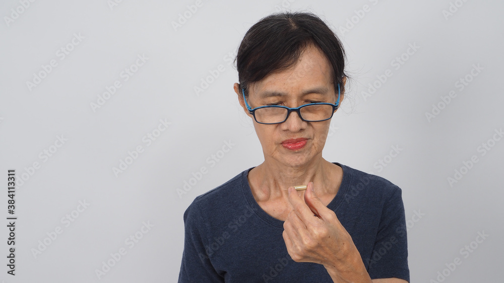 Asian senior or older woman had a back pain posture on white background. Asian senior or older woman had a back pain posture on white background.