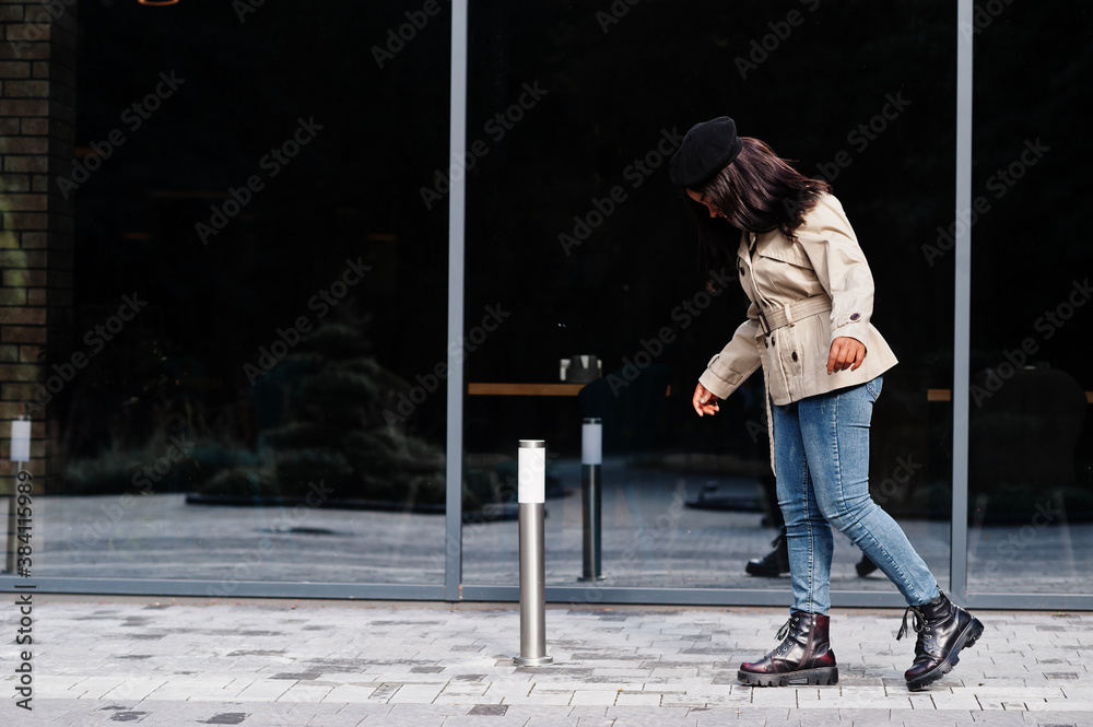 Fashionable african american woman wear beret and coat posing outdoor. Fashionable african american woman wear beret and coat posing outdoor.