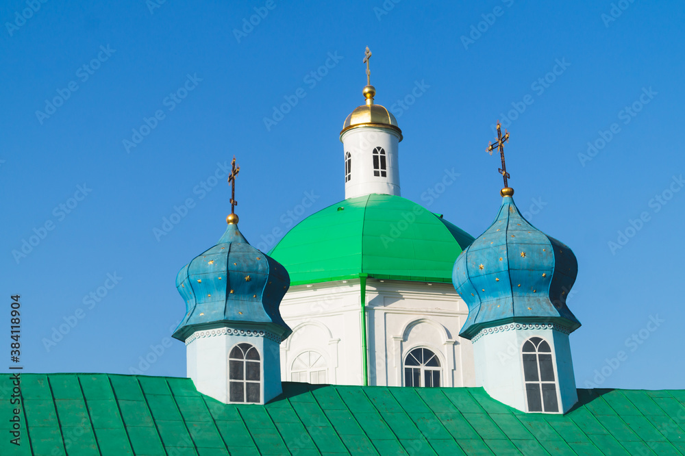 Colorful domes of old church with the crosses