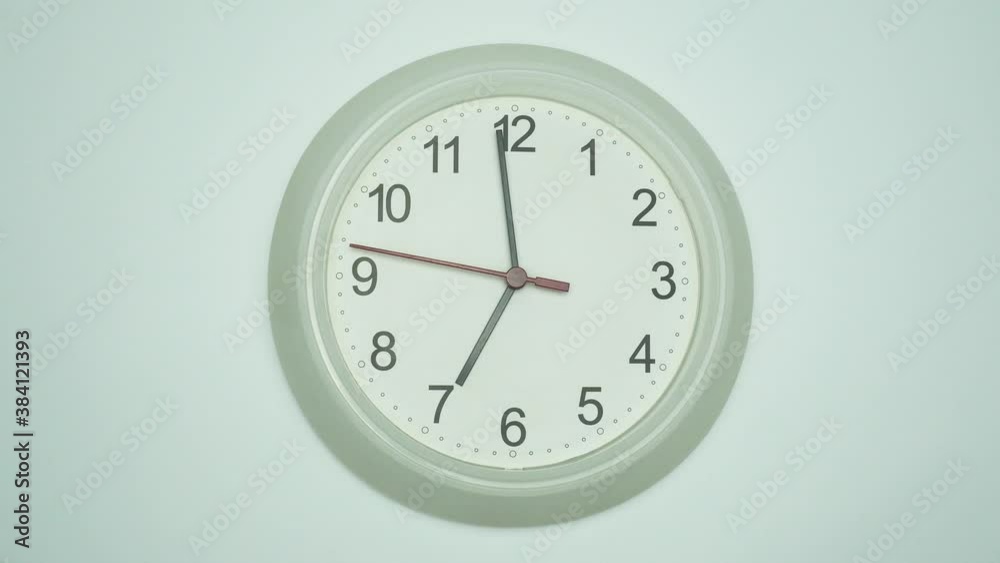 Wall clock isolated on white background, Showtime 07.00 am or pm, second hand minute walk slow motion. Wall clock isolated on white background, Showtime 07.00 am or pm, second hand minute walk slow motion.