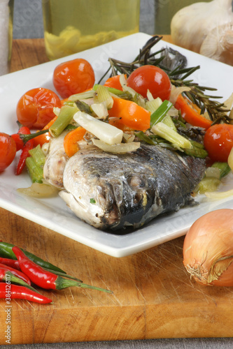 organic sea bream from greece with vegetable photo