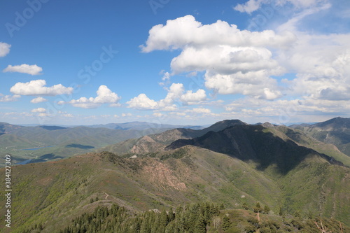 Quadro em tela Clouds float above the grassy alpine peaks of the Wasatch mountains in Utah