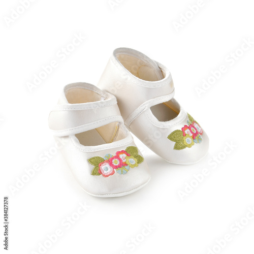 Old fashioned baby shoes for girls isolated on white background 