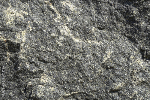Raw natural granite for the background, front view