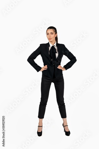 Full length portrait of a happy woman girl businesswoman posing in business suit blazer over isolated white background