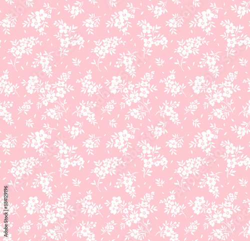 Vector seamless pattern. Pretty pattern in small flowers. Small white flowers. Light pink background. Ditsy floral background. The elegant the template for fashion prints.