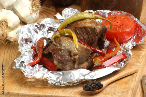 braised meat in tinfoil with grilled paprika