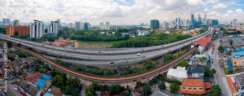 Aerial Panorama Cityscape_Kuala Lumpur_Malaysia_Ampang. Drone Shot. LRT trail beside highway photo