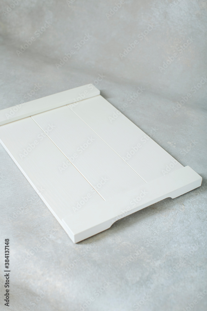 Fototapeta premium white cutting board on grey background