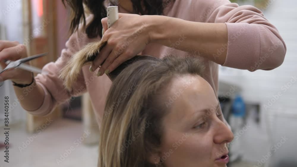 Hair appointment. Caucasian girl getting her hair cut at the haircare salon. Selfcare and Beauty concept Hair appointment. Caucasian girl getting her hair cut at the haircare salon. Selfcare and Beauty concept