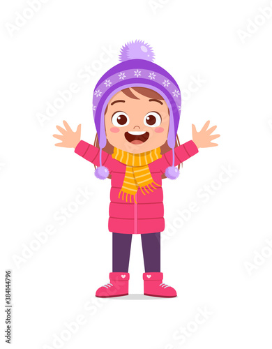 happy cute little kid play and wear jacket in winter season. child smile wearing warm clothes