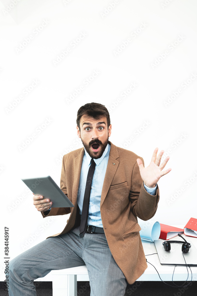 Businessman with shocked expression at office Businessman with shocked expression at office