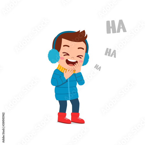 happy cute little kid play and wear jacket in winter season. child laugh wearing warm clothes