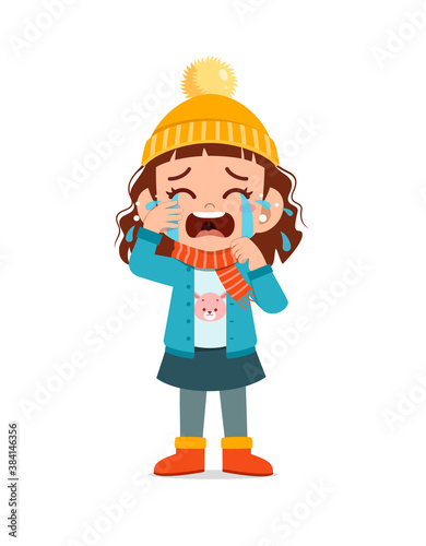 sad cute little kid cry and wear jacket in winter season. child scream crying wearing warm clothes