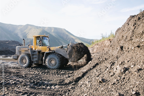 Wheel loader during earthworks in mountainous area - Mining