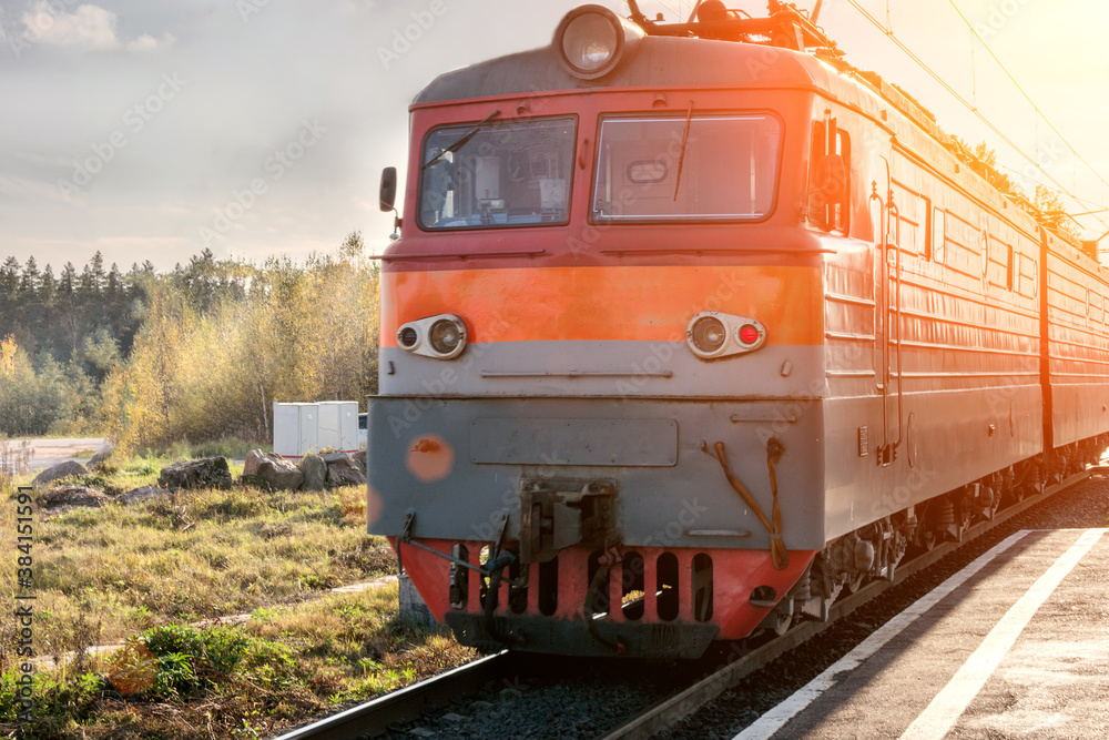 Obraz premium locomotive close-up, on railway tracks, in autumn and sunlight.