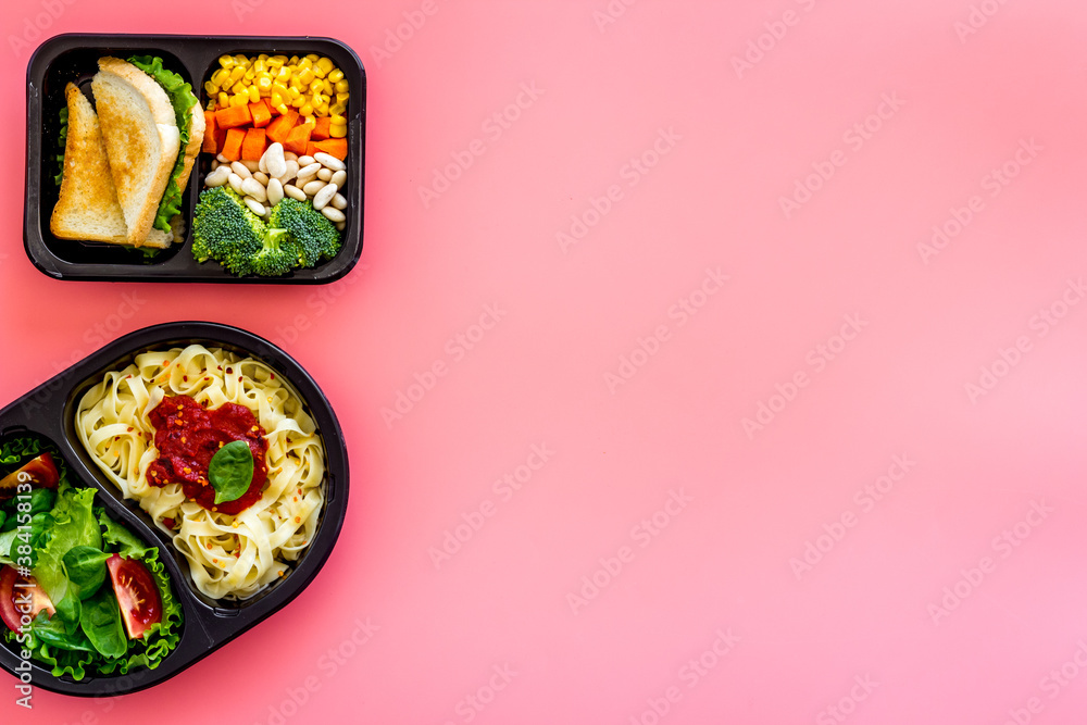 Lunch boxes with meal. Food delivery concept. Overhead view Lunch boxes with meal. Food delivery concept. Overhead view
