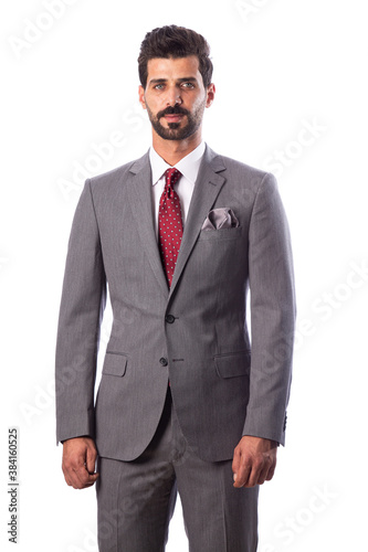 A young man wearing a black suit on a white background