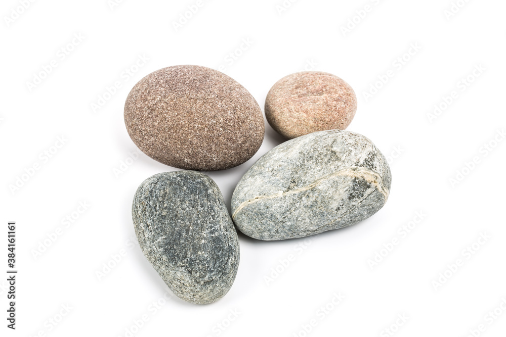 Studio photo of stacked, natural stone pebbles isolated on white background with soft shadow. Studio photo of stacked, natural stone pebbles isolated on white background with soft shadow.