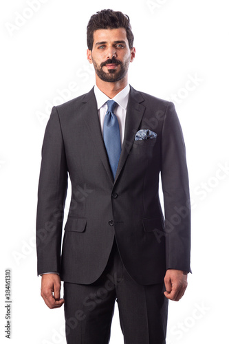 A young man wearing a black suit on a white background