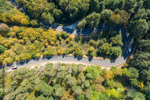 Curvy road from aboveBird's eye view of a winding road through the forest in the Taunus / Germany in autumn