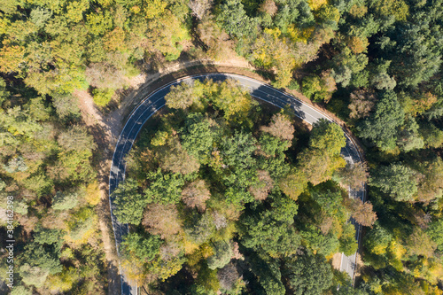 Curvy road from aboveBird's eye view of a winding road through the forest in the Taunus / Germany in autumn
